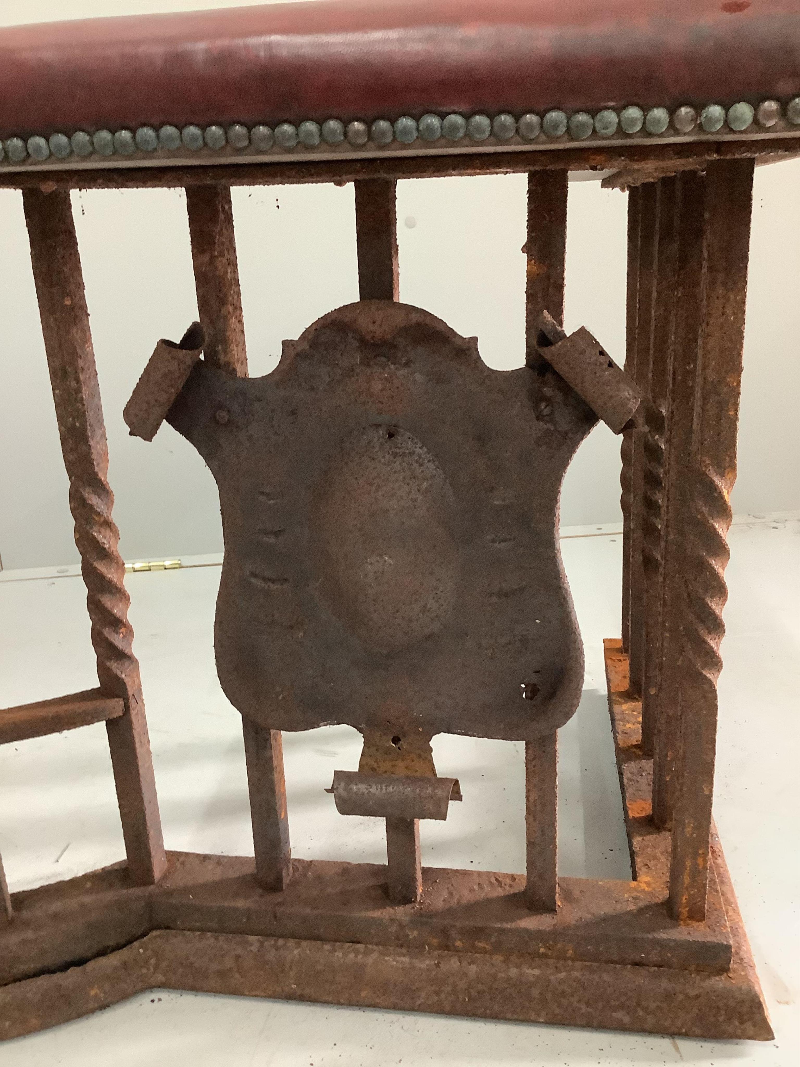 An early 20th century wrought and cast iron bow front club fender, width 160cm, depth 56cm, height 55cm. Condition - poor (in need of restoration)
